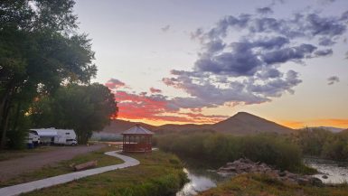 Riverfront camping at Woods & River RV Park in Del Norte, CO